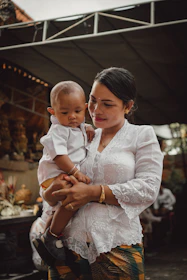 a person holding a baby