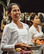 a person holding a plate of food