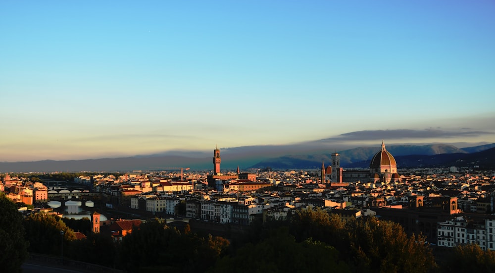 a city with a large tower in the distance