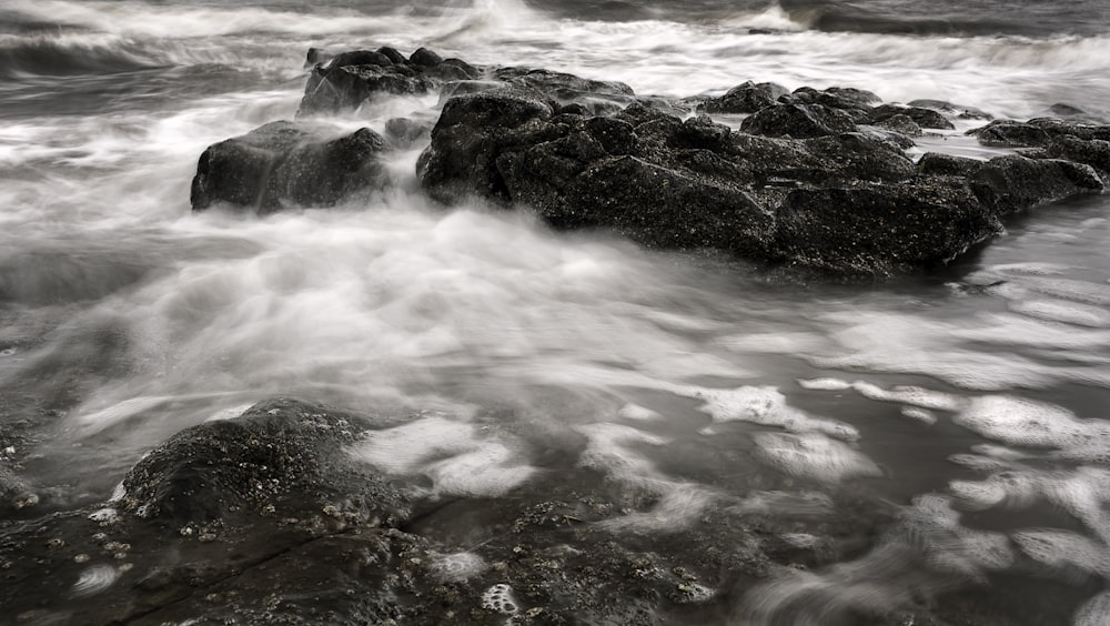 a body of water with rocks in it