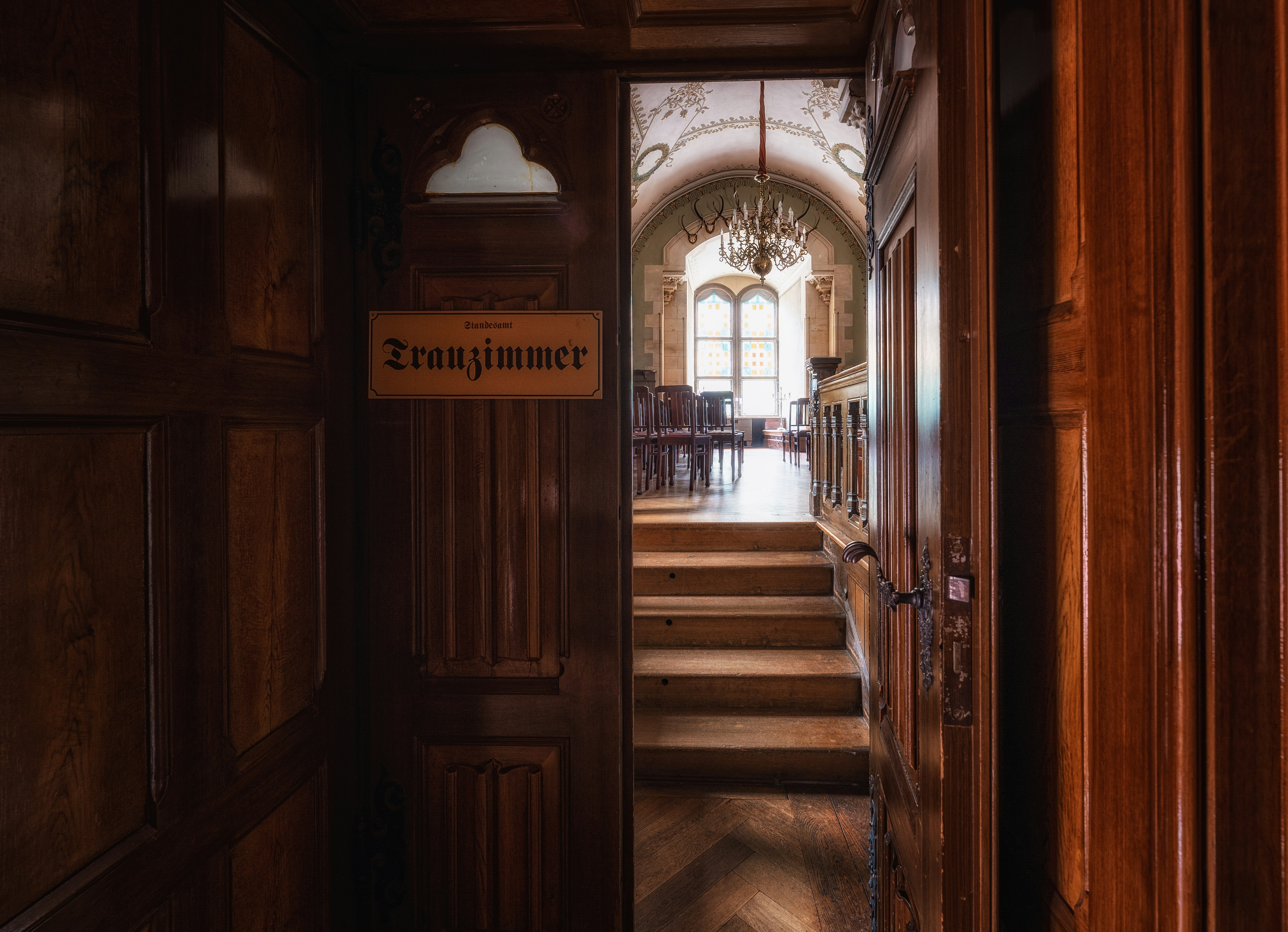 a hallway with wooden doors