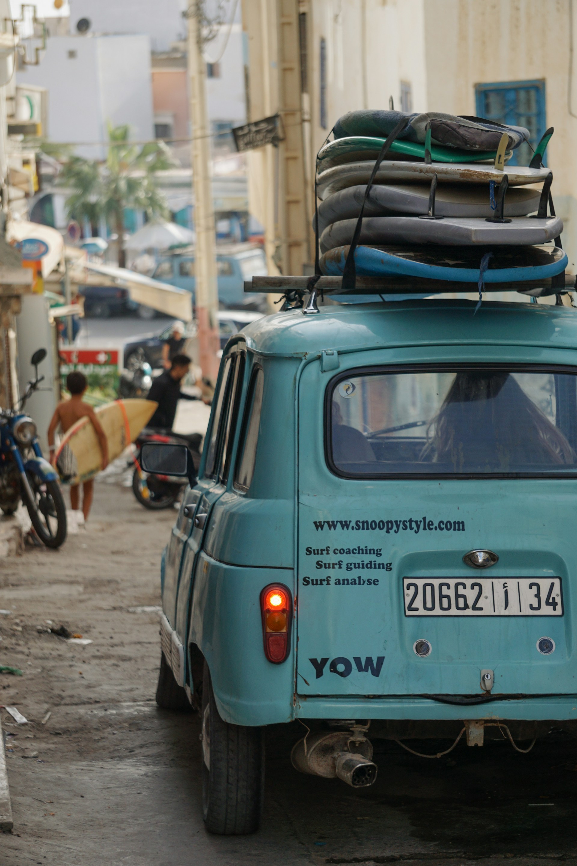 a truck with a surfboard on the back