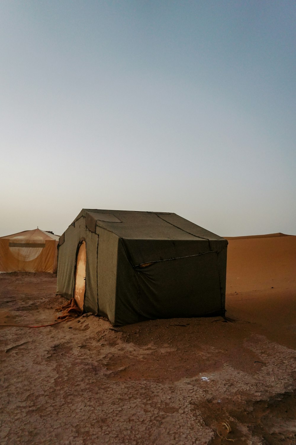 a group of tents in a desert