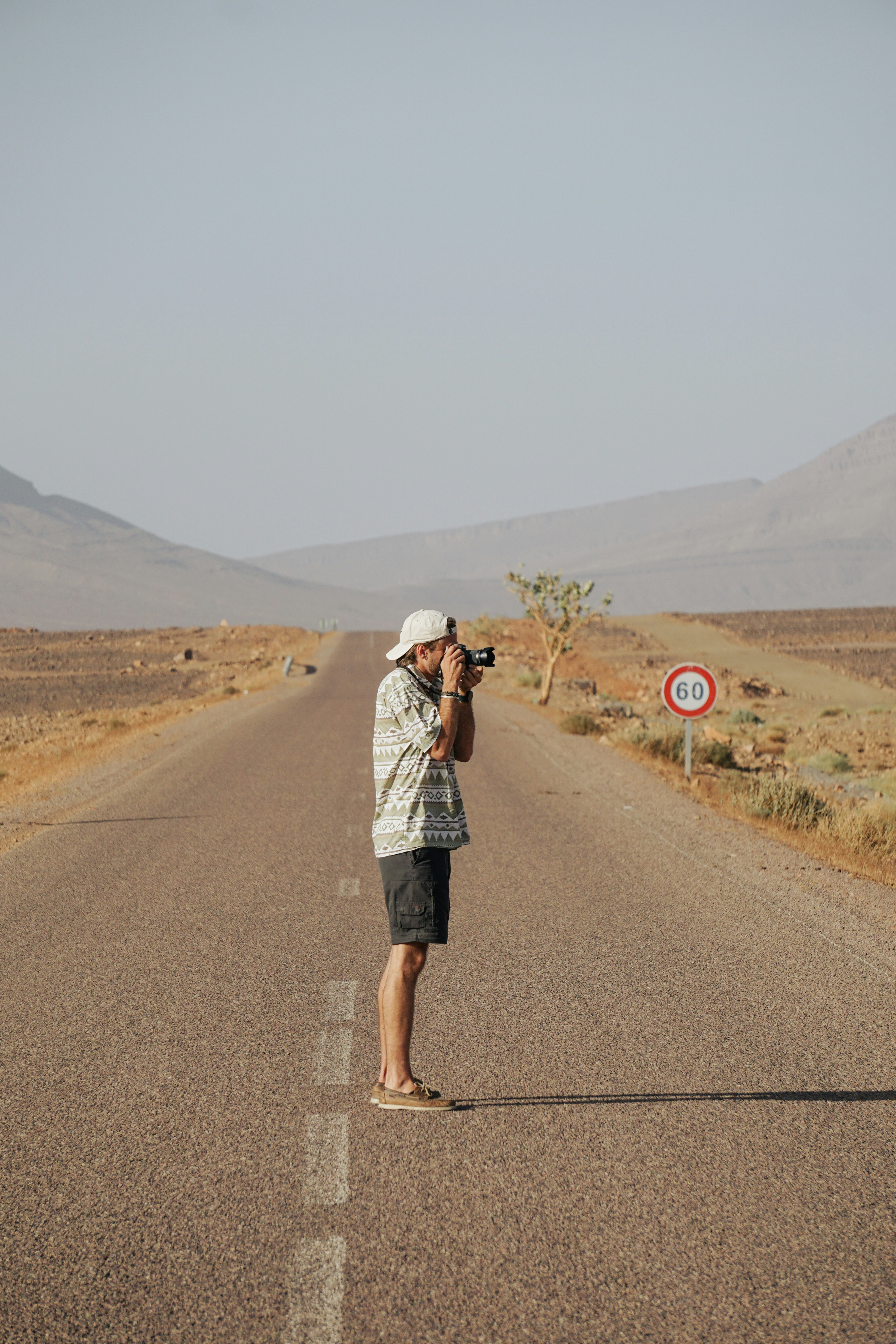 A man taking a picture of a road photo – Free Van Image on Unsplash