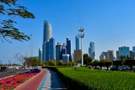 a city skyline with a sidewalk and cars