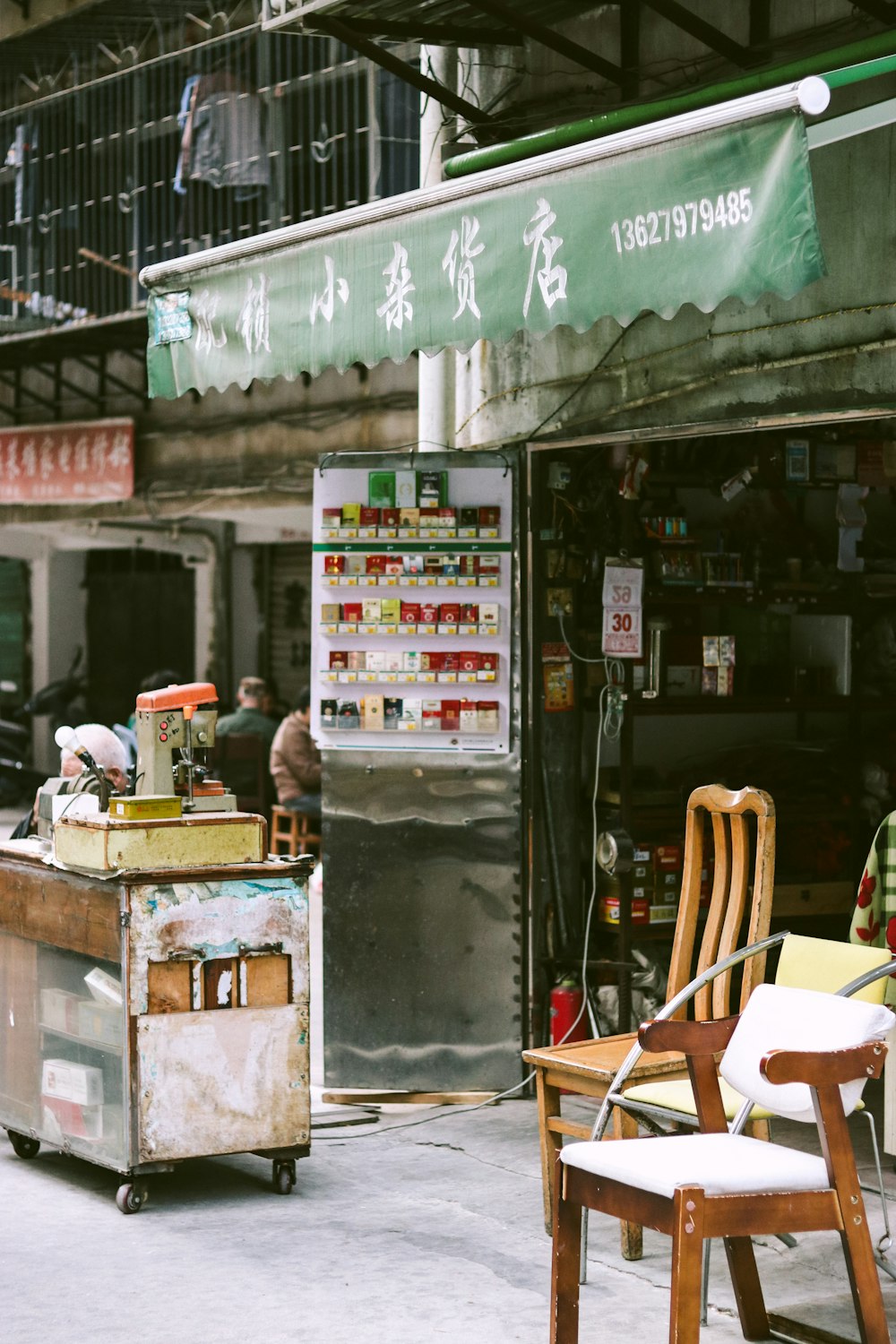 a store front with a green sign