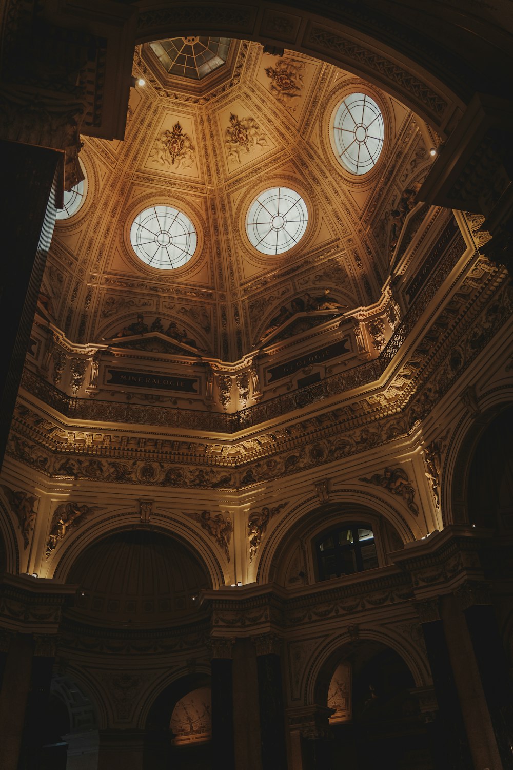 a large ornate ceiling with arched windows