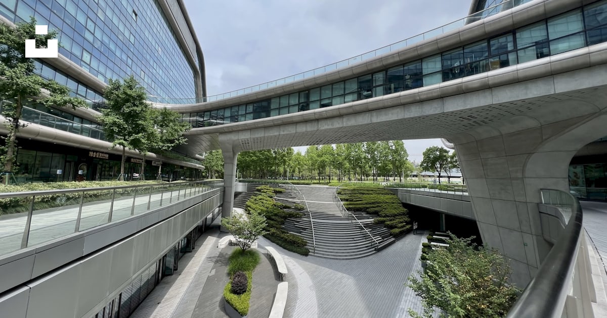 A walkway between buildings photo – Free Building facade Image on Unsplash