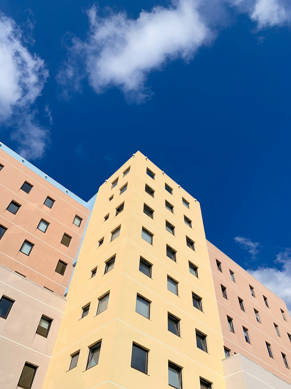 a tall building with a blue sky