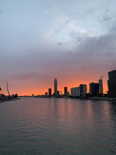 Vibrant view of Brisbane's city skyline at sunset with the Story Bridge lit up.