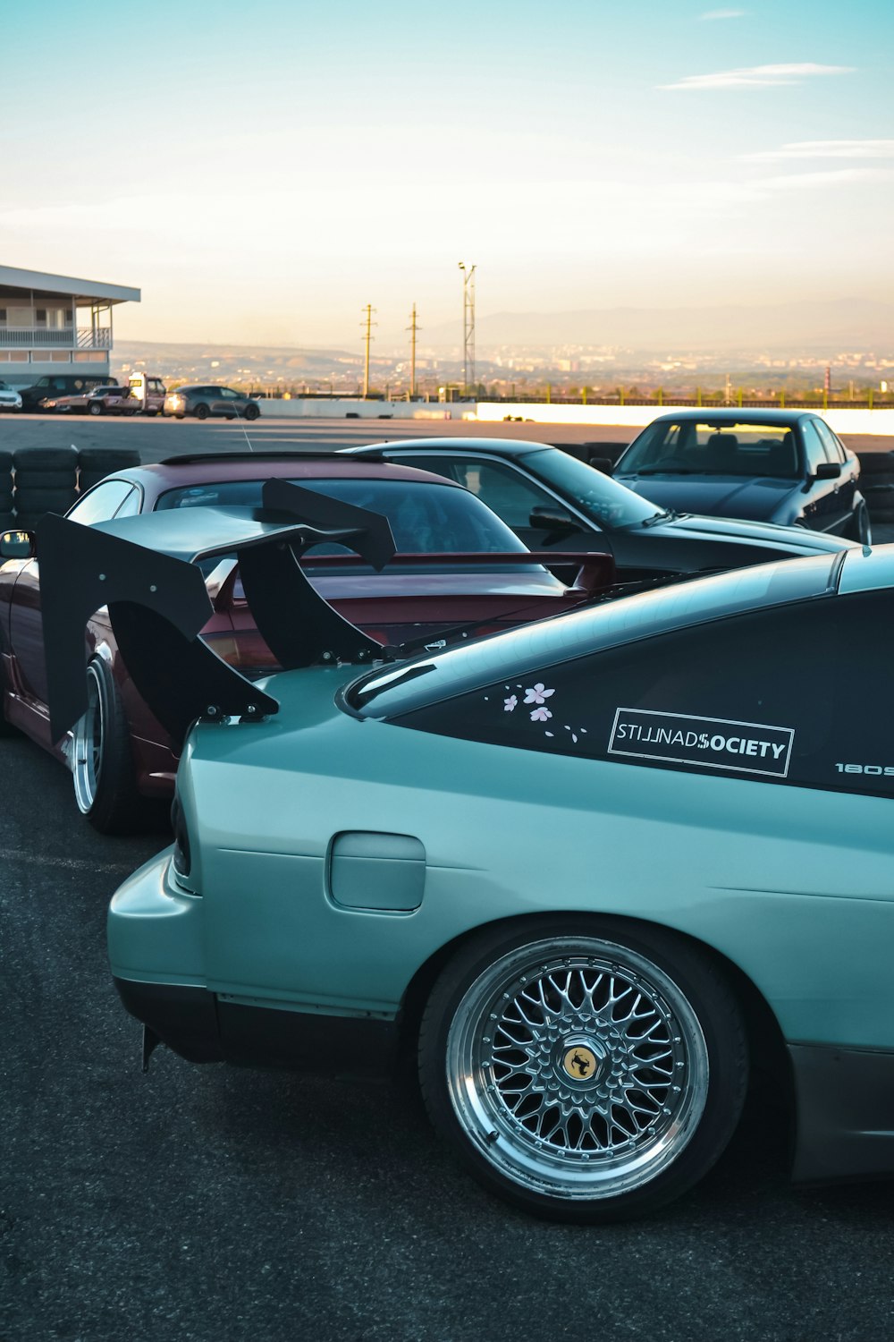 a group of cars parked in a parking lot