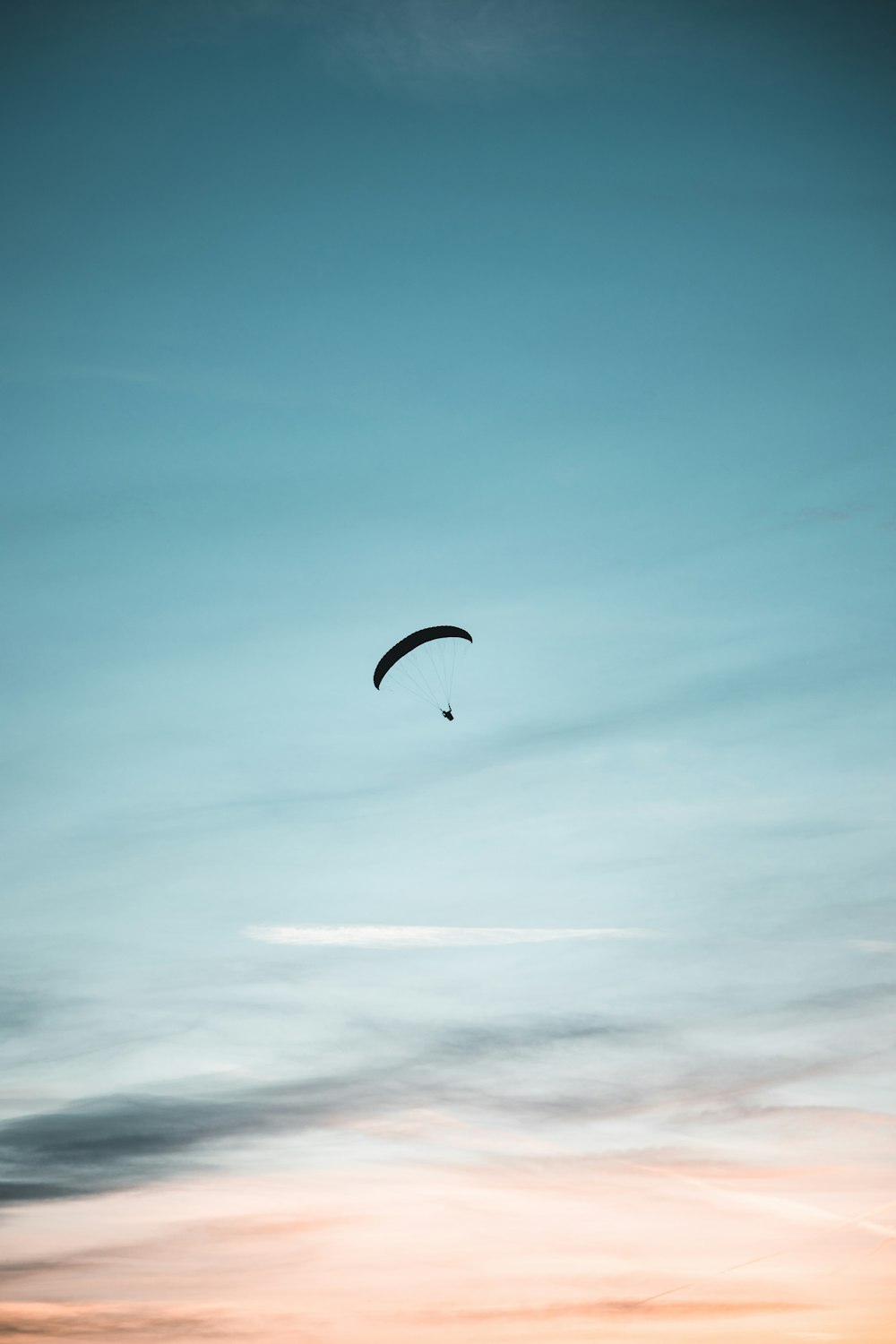 a person parachuting in the sky