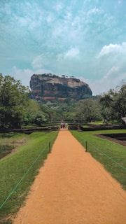 a path leading to a large rock formation