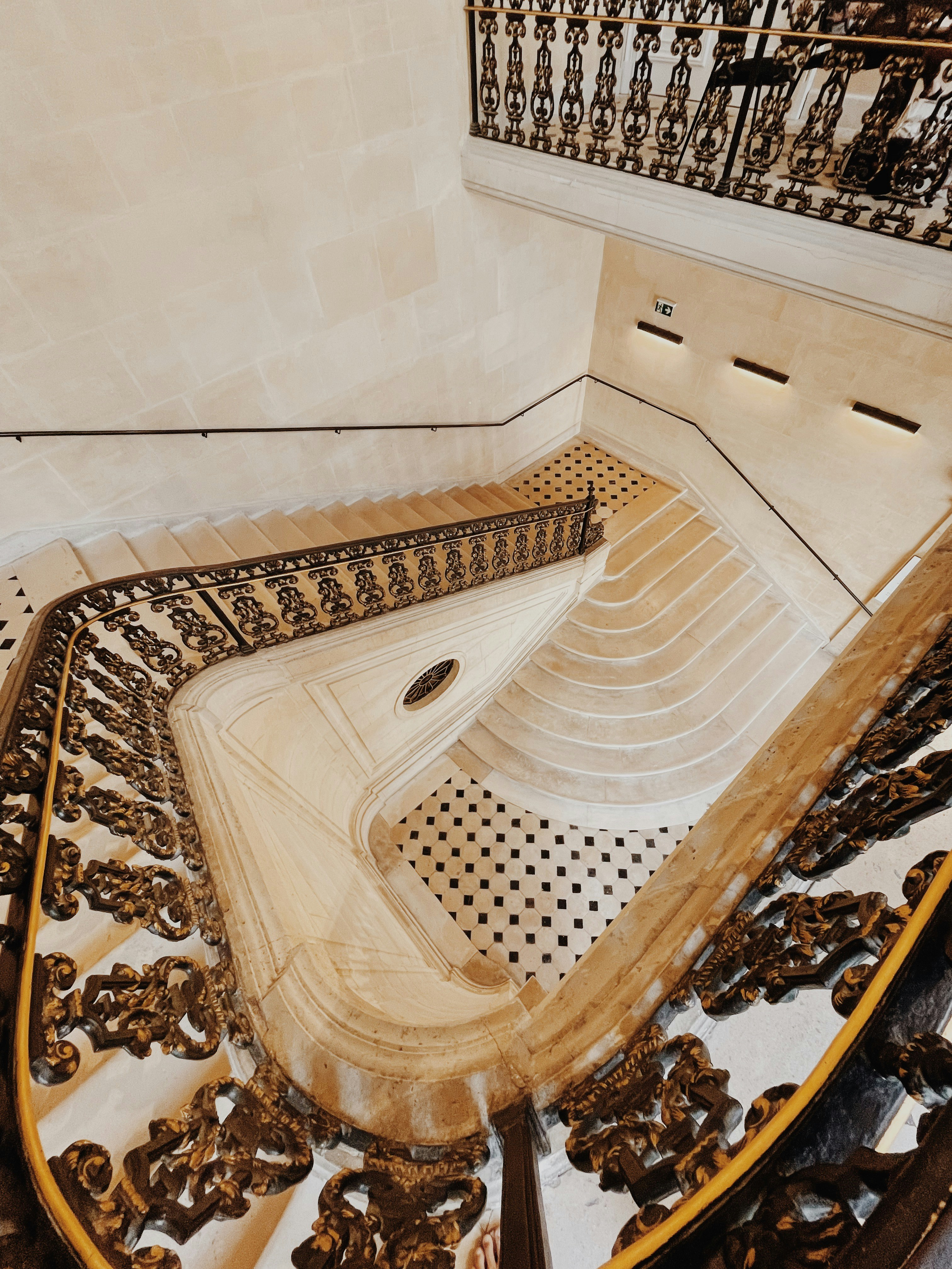 A staircase with gold railings photo – Free Paris Image on Unsplash