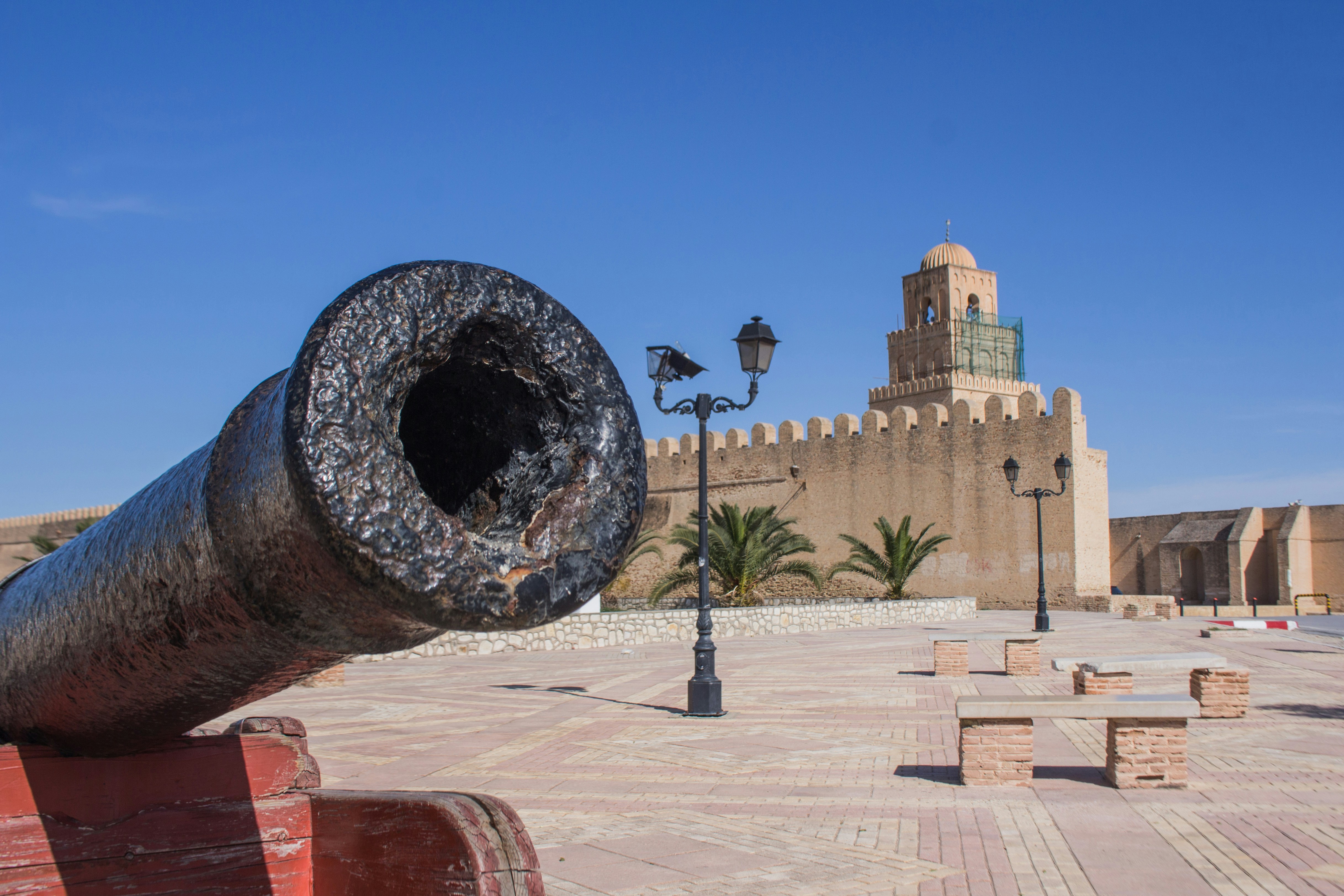 The old wall of Kairouan medina guarded with canon in the from one of their entrance