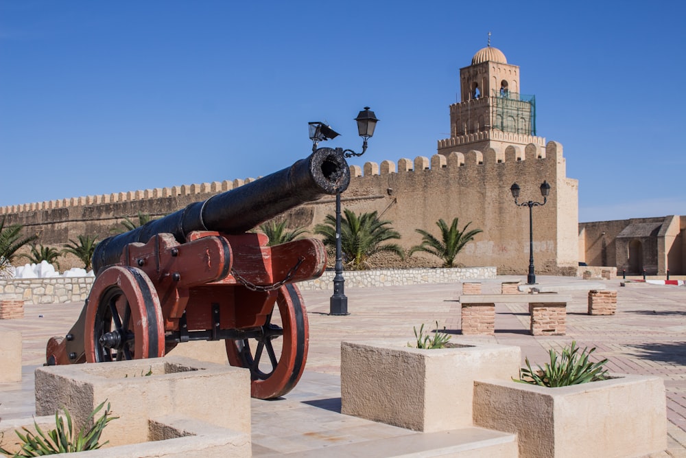 a cannon on display in front of a building