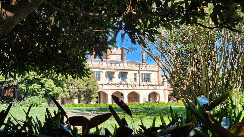 a large house with trees in front of it