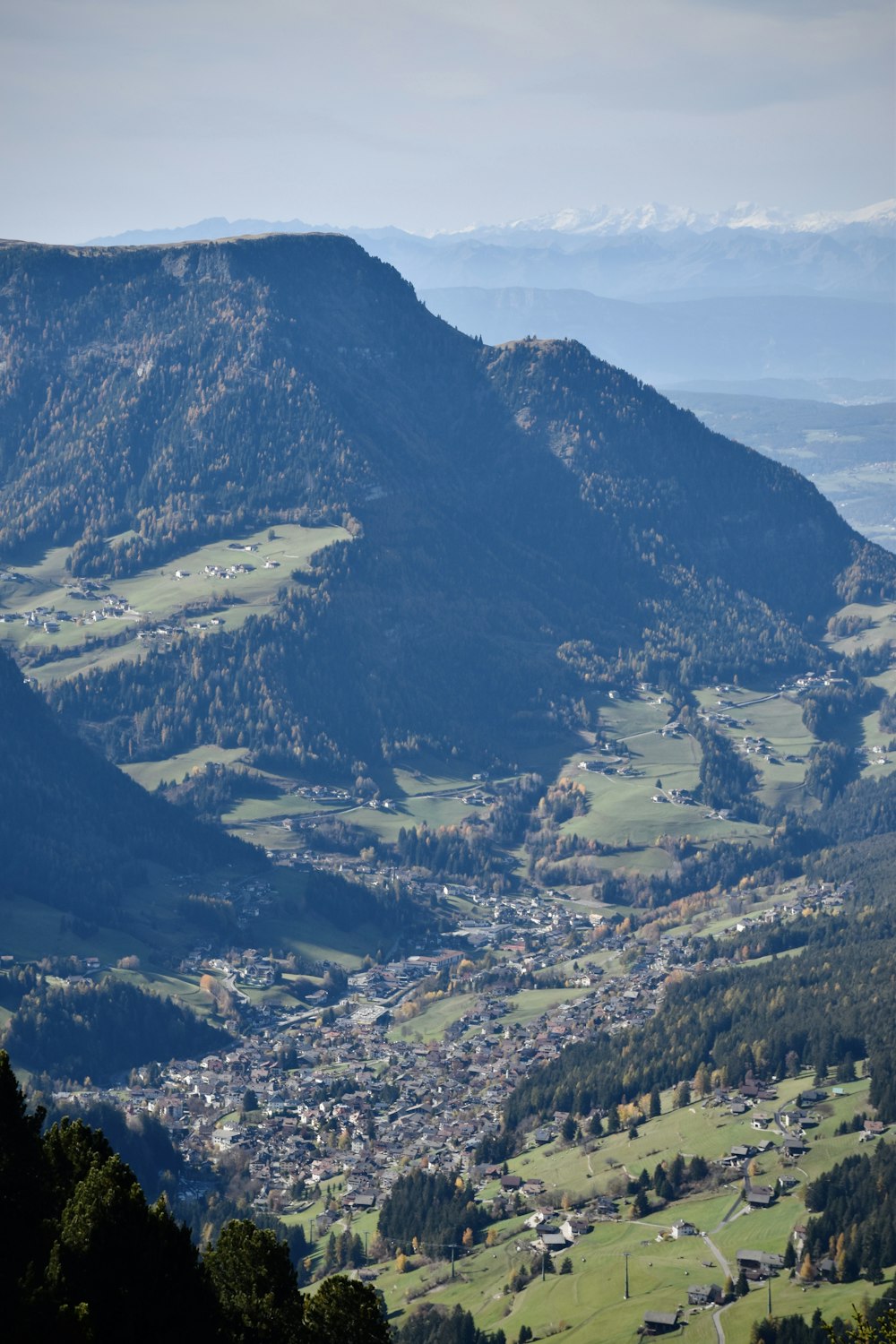 a large mountain with a river running through it