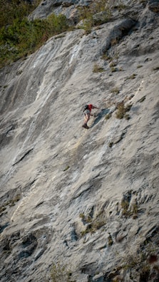 a person climbing a rock