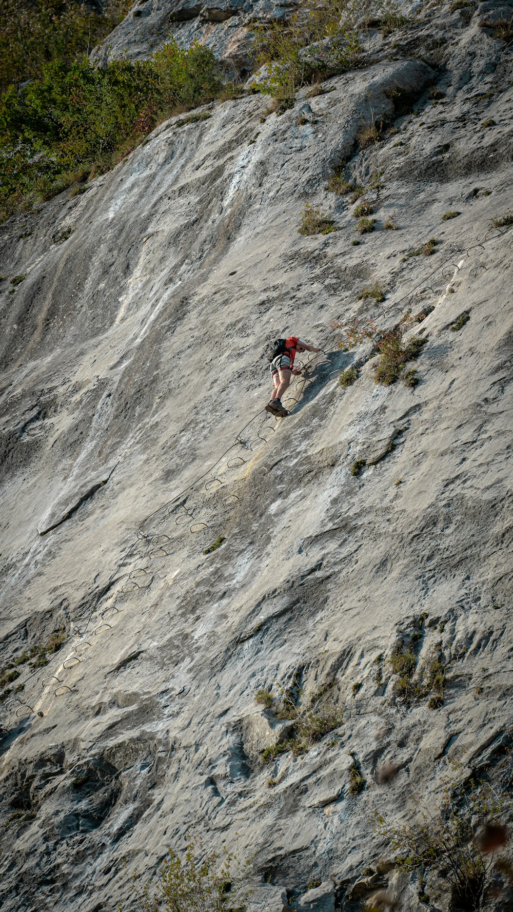 a person climbing a rock