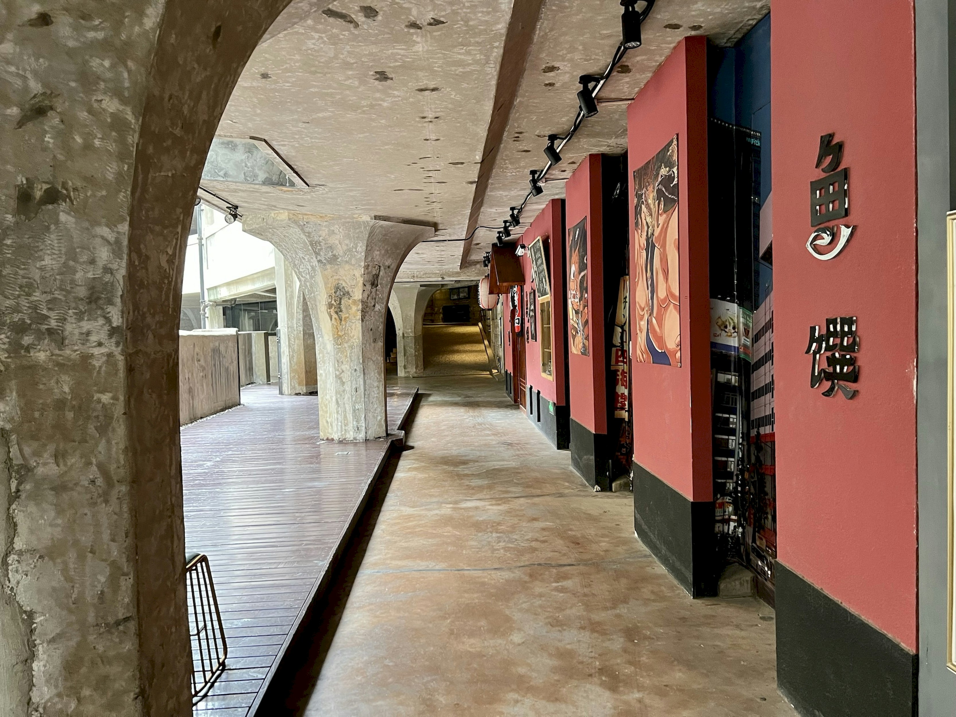 a long hallway with red walls