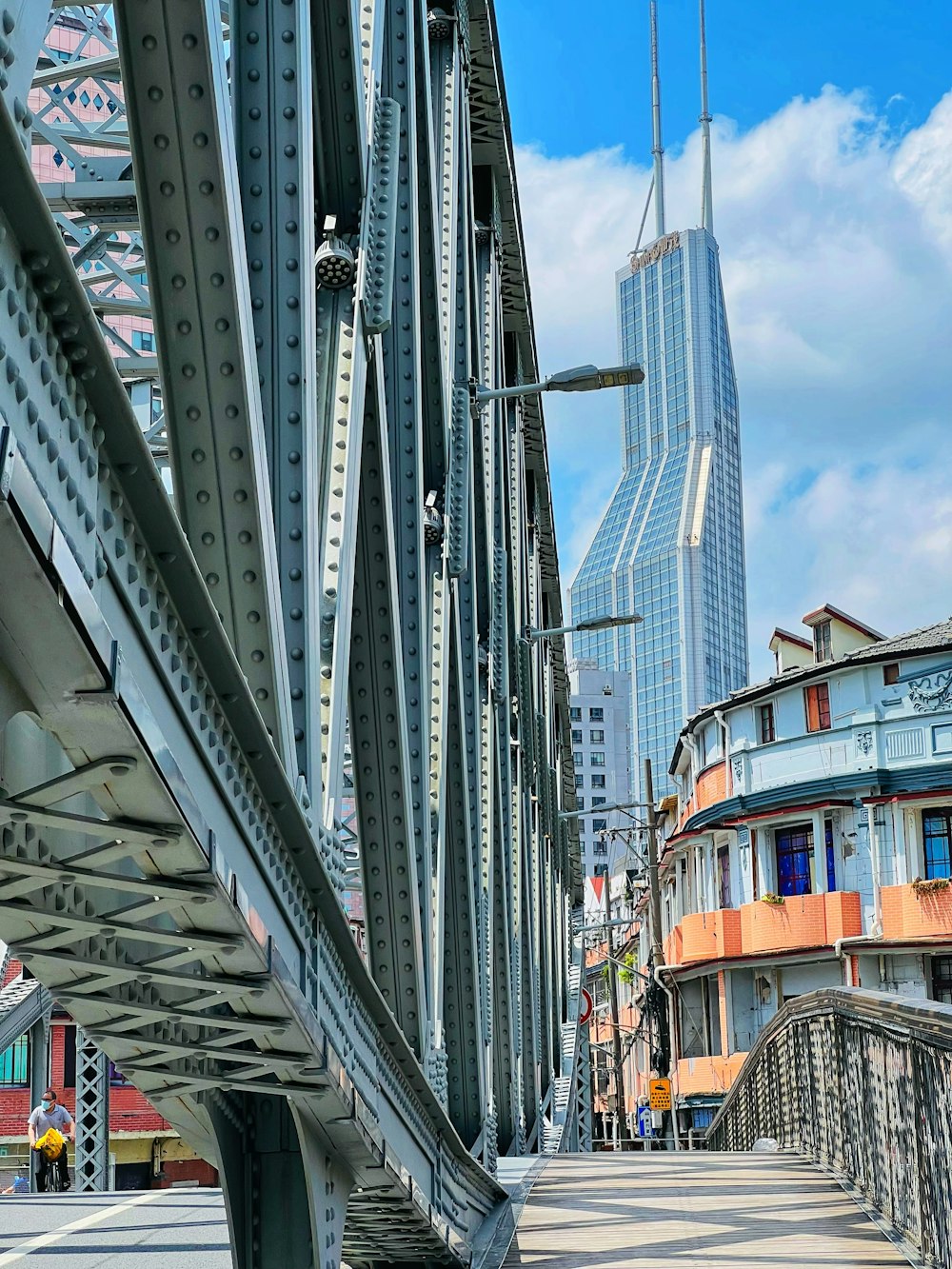 a bridge with a tall building in the background