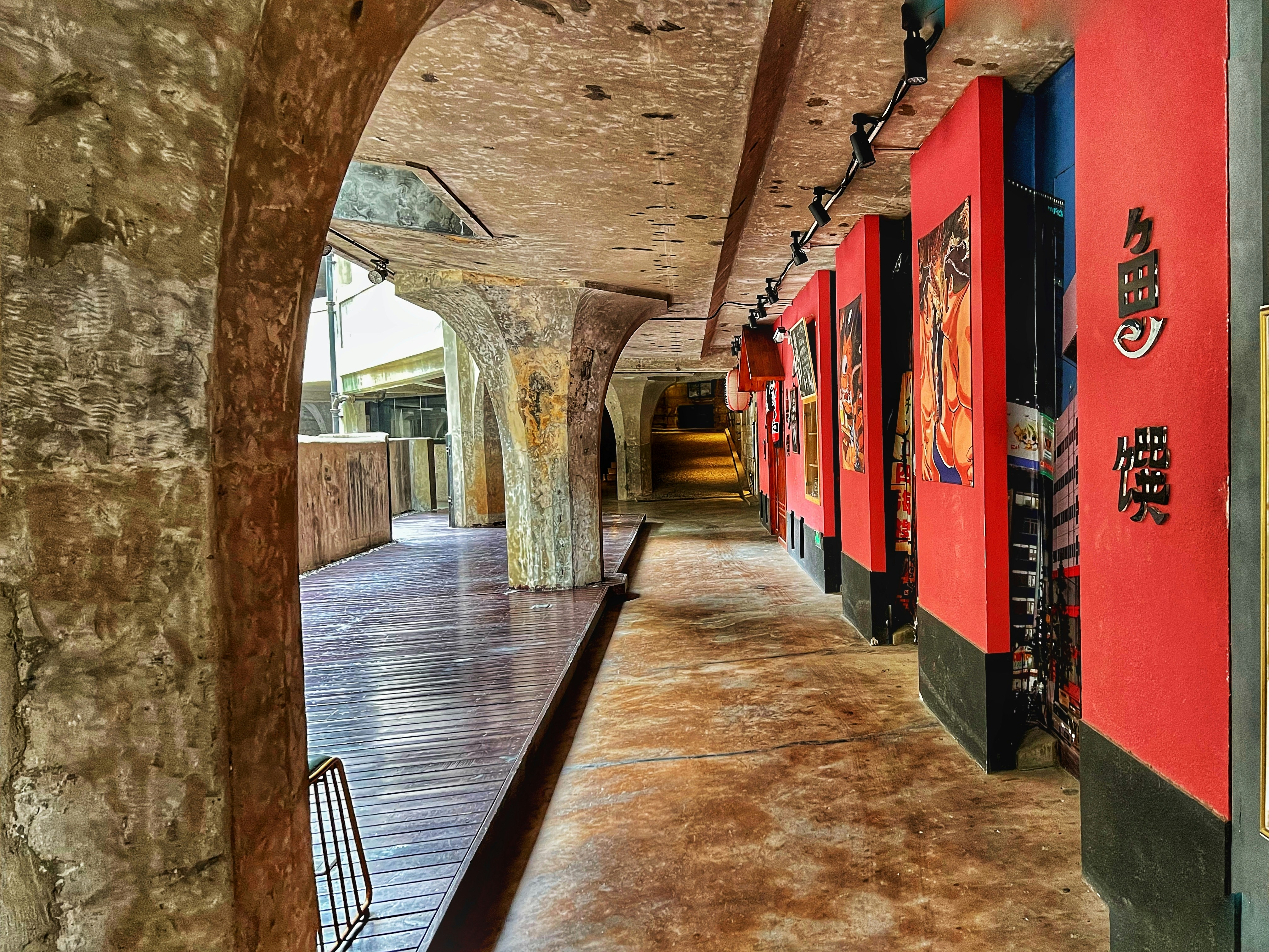 a long hallway with paintings on the walls