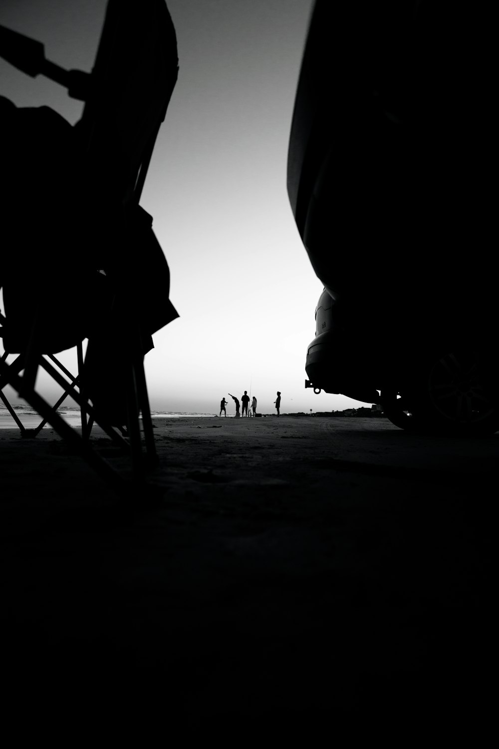 a group of people walking on a beach