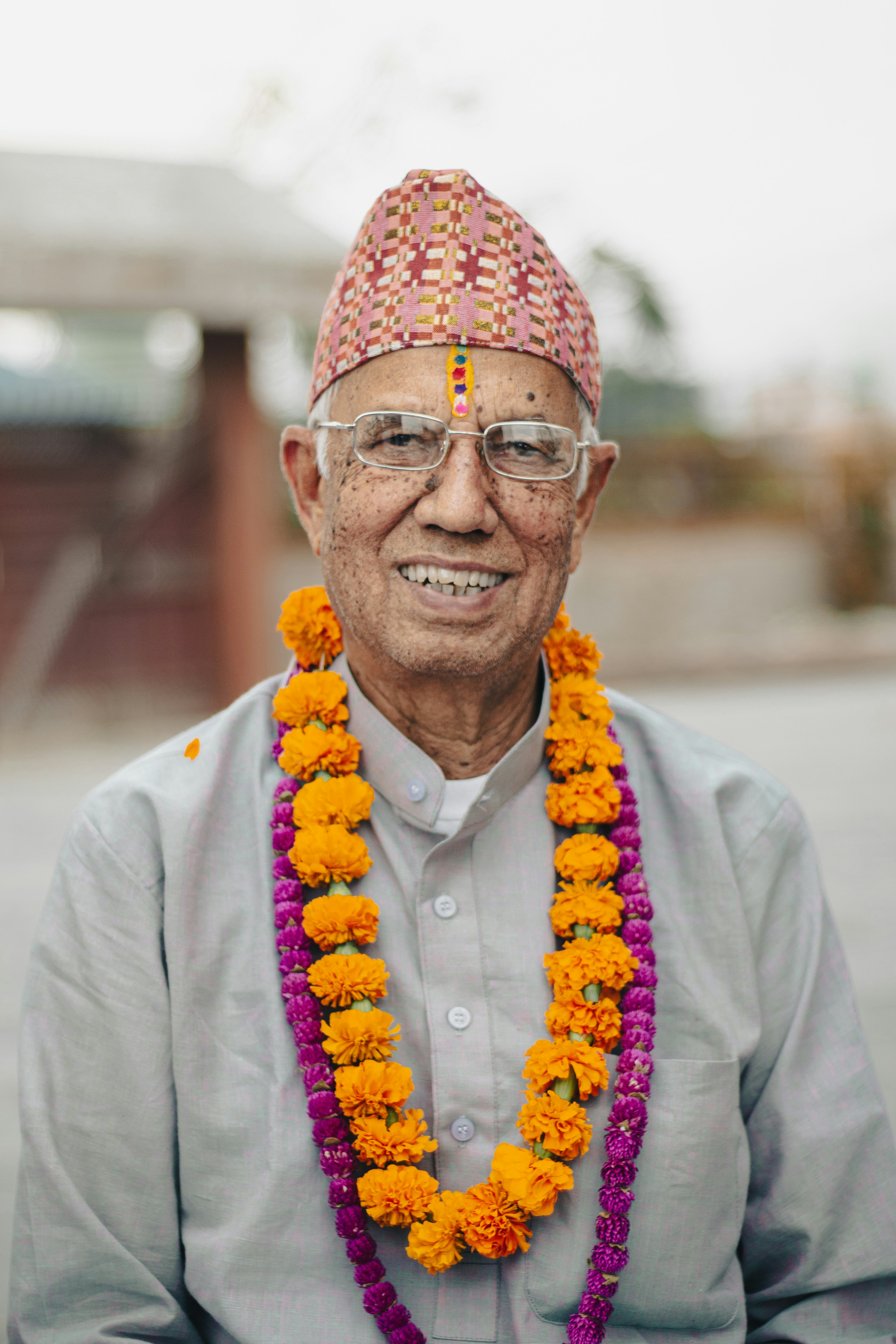a man wearing a hat and glasses