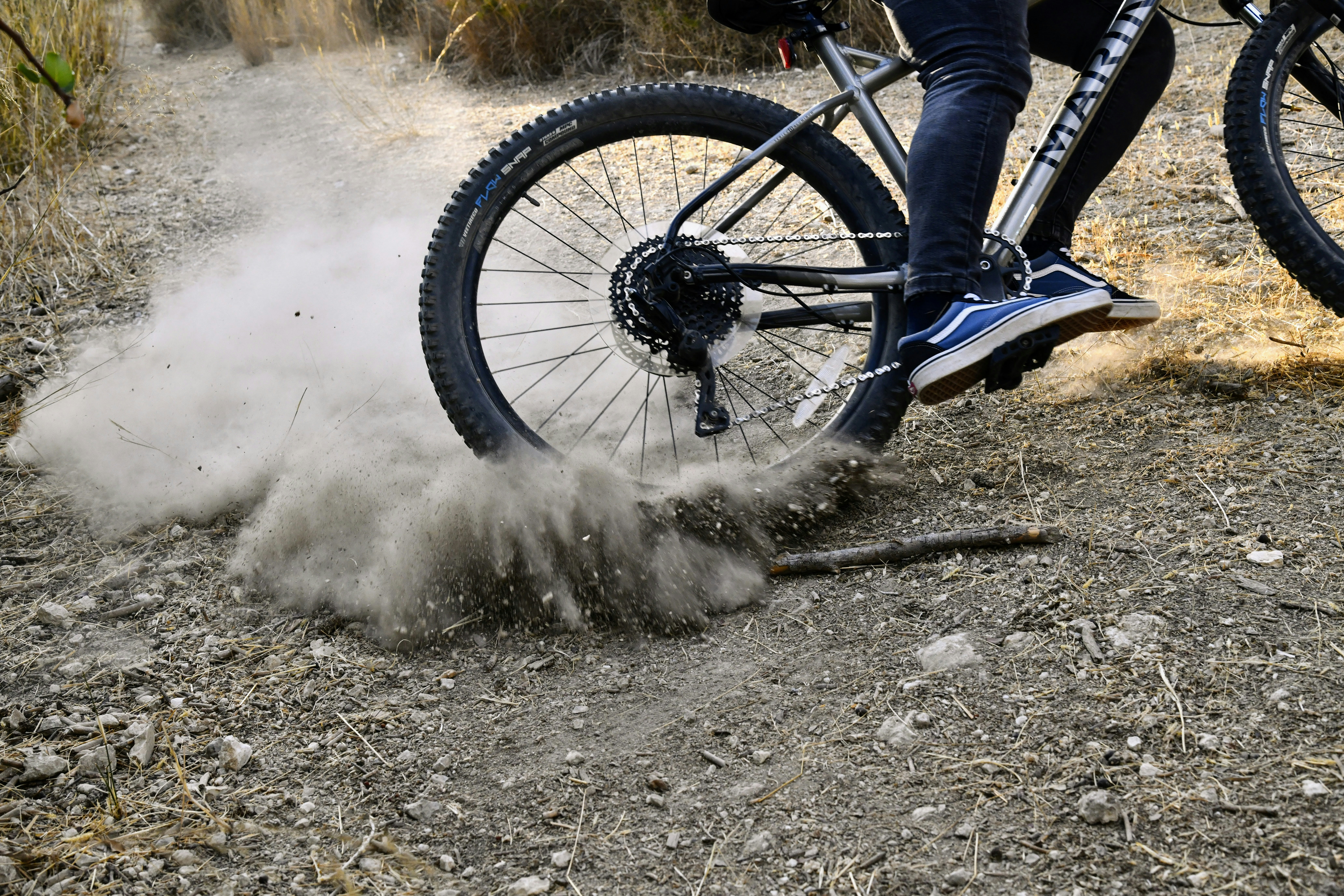 a person riding a bike in the dirt