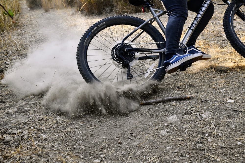 a person riding a bike in the dirt