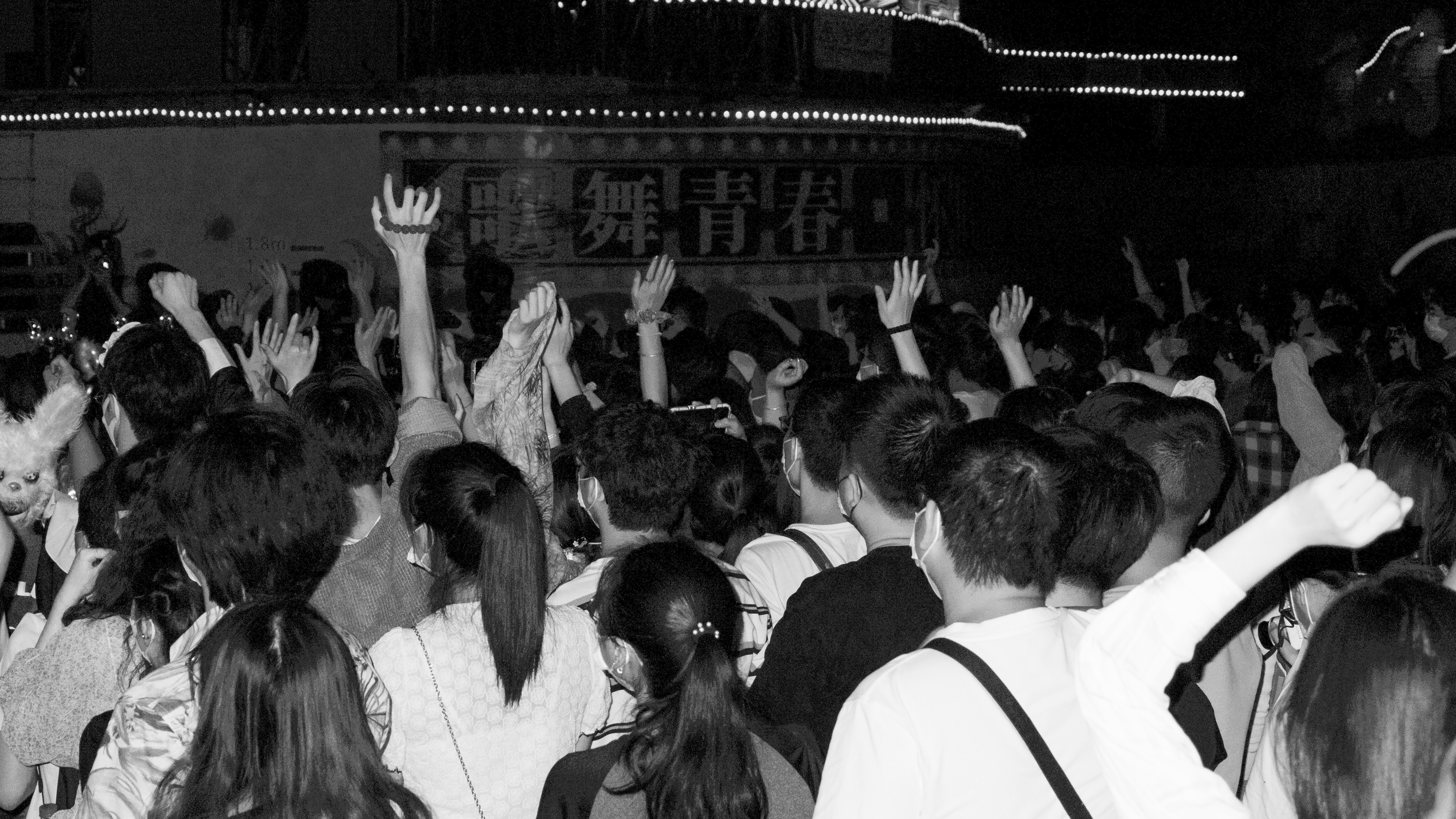 a crowd of people in a room