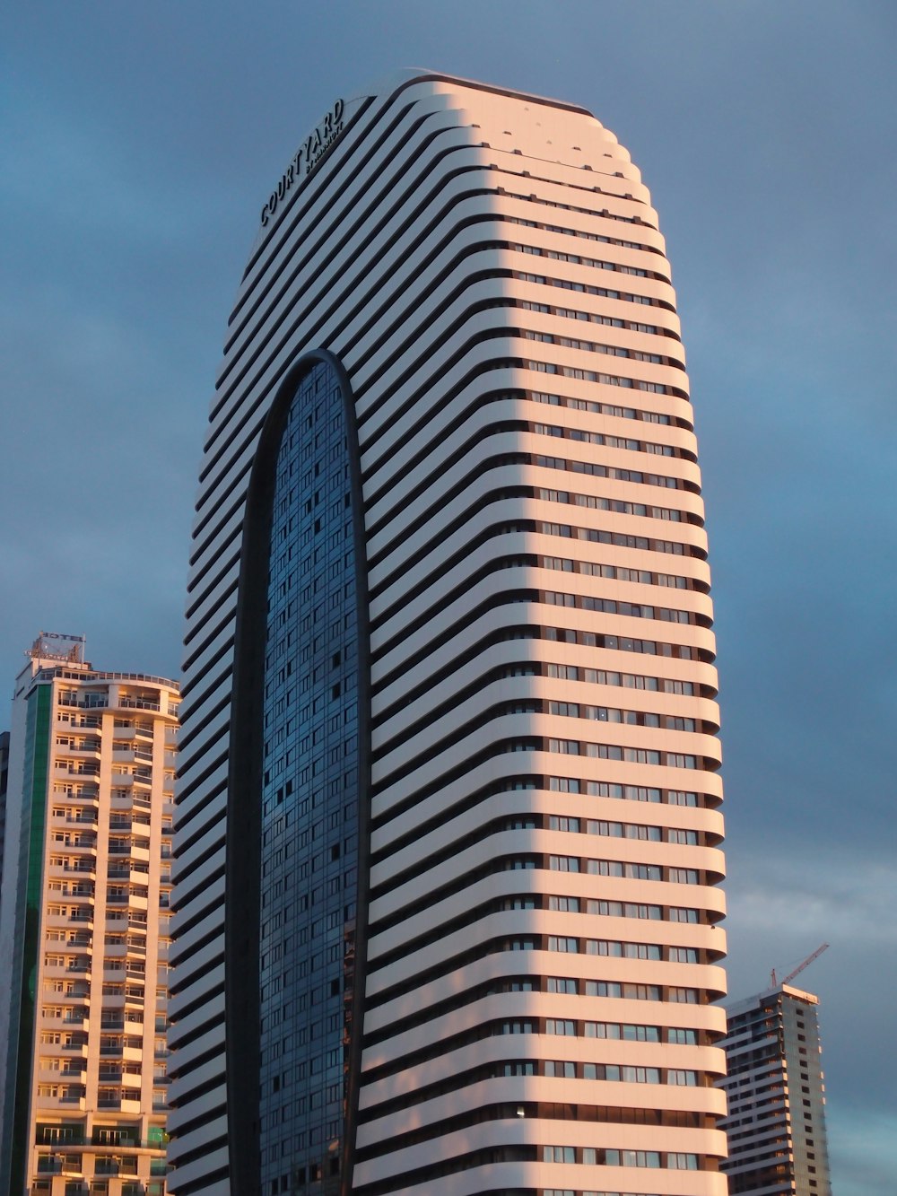 a tall building with a glass front