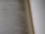 A close-up view of an open book with text discussing the qualities of a wife of noble character. The focus is on a specific passage, while the rest of the text is blurred, creating a depth of field effect.