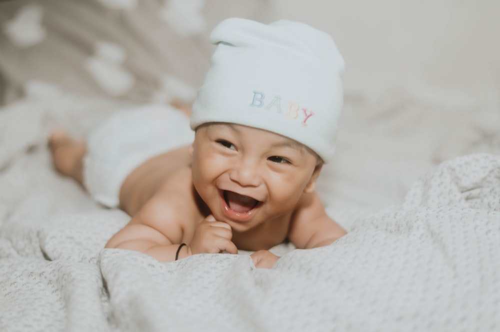 a baby wearing a white hat