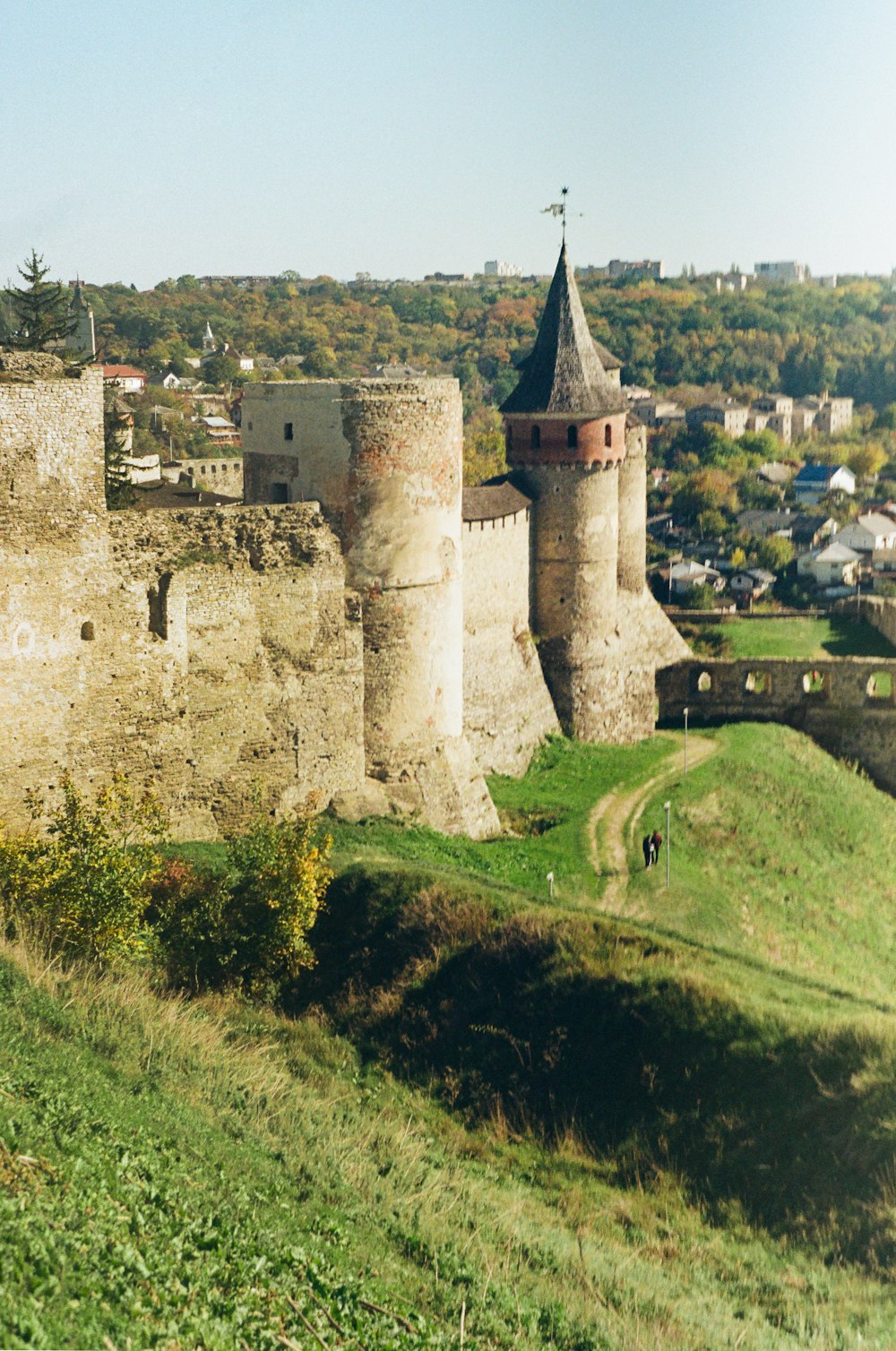 a stone castle on a hill