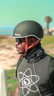 a person wearing a skateboard helmet and goggles