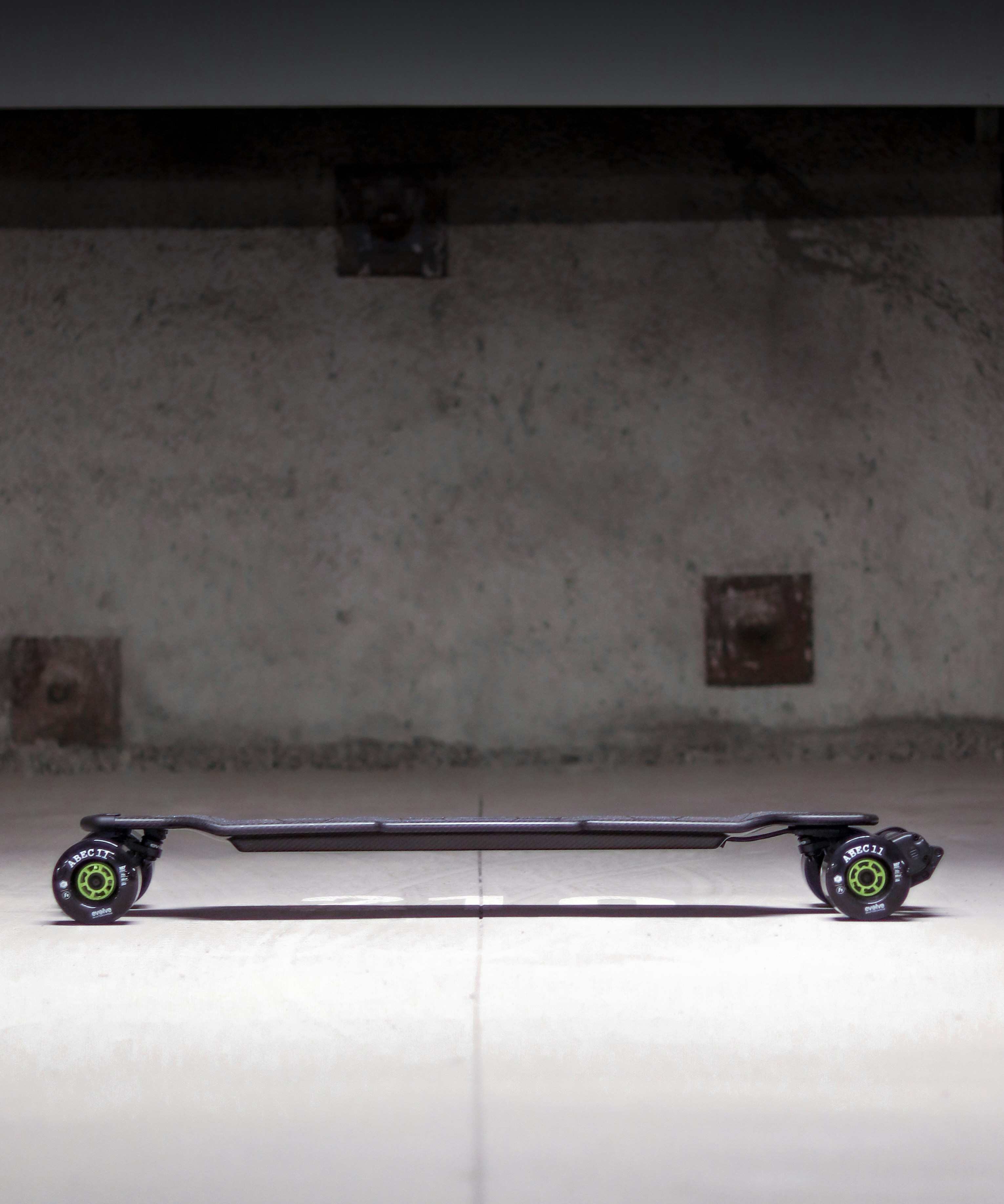 a skateboard leaning against a wall