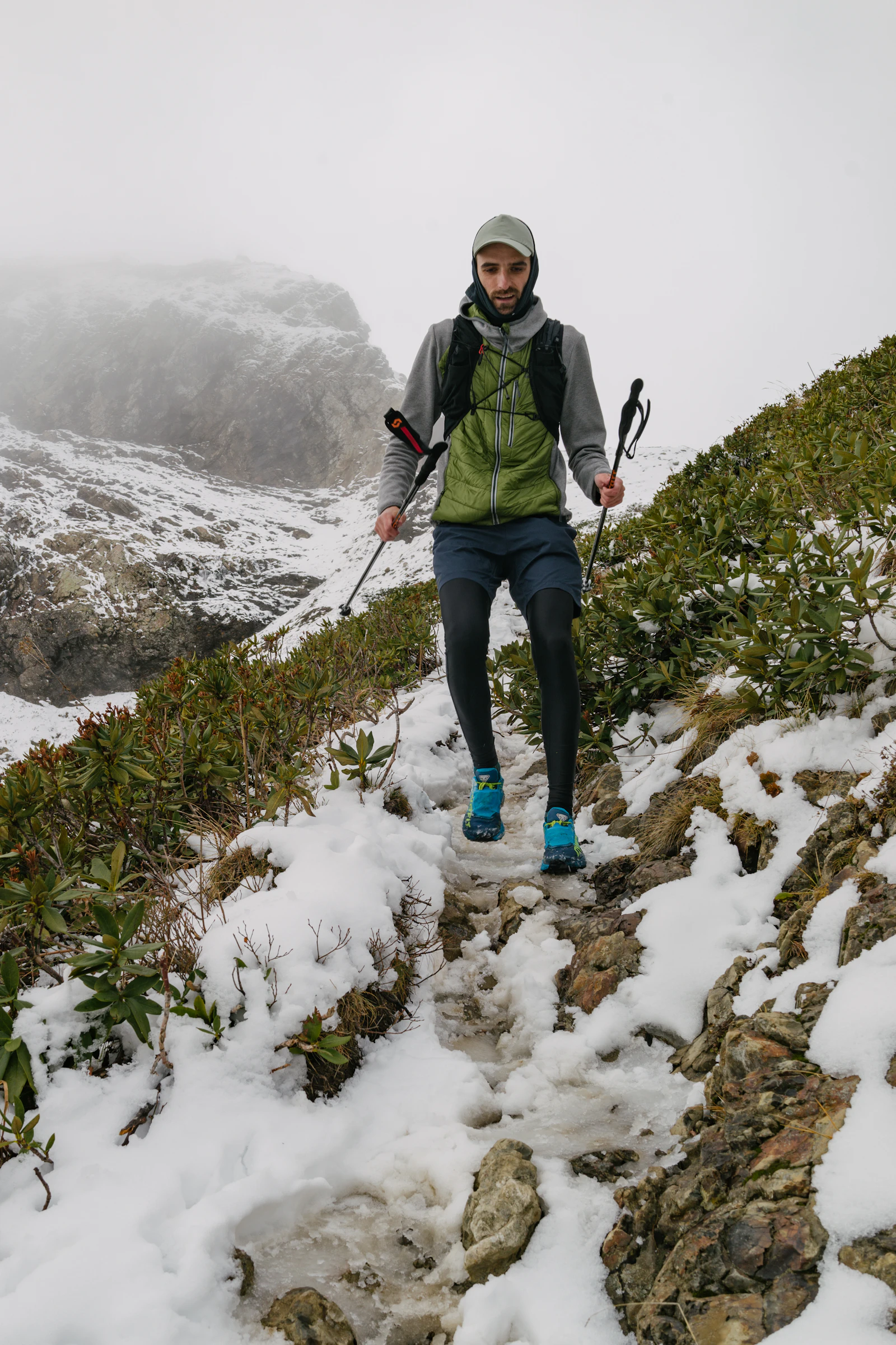 Person standing on a snowy mountain slope