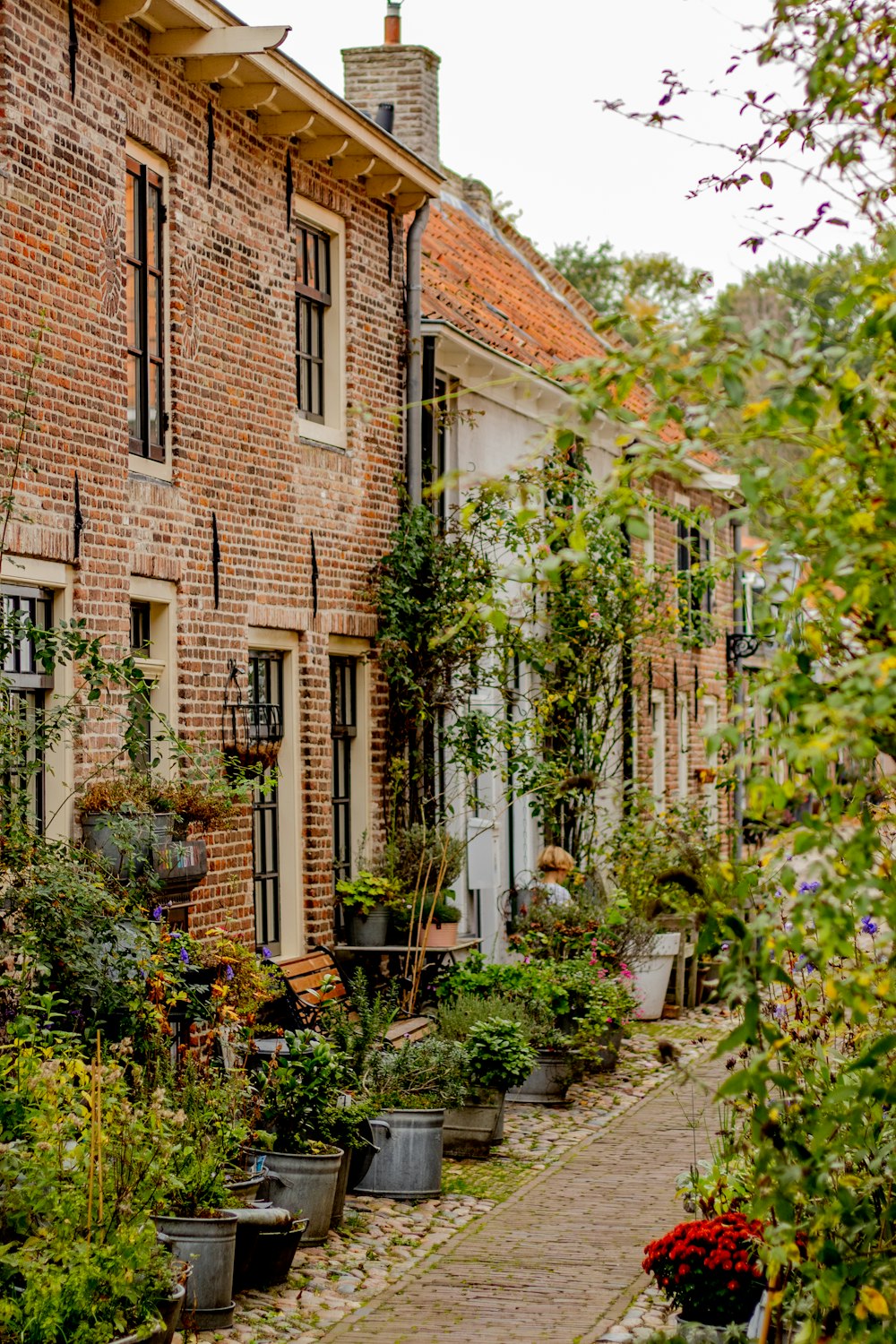 a brick building with a garden