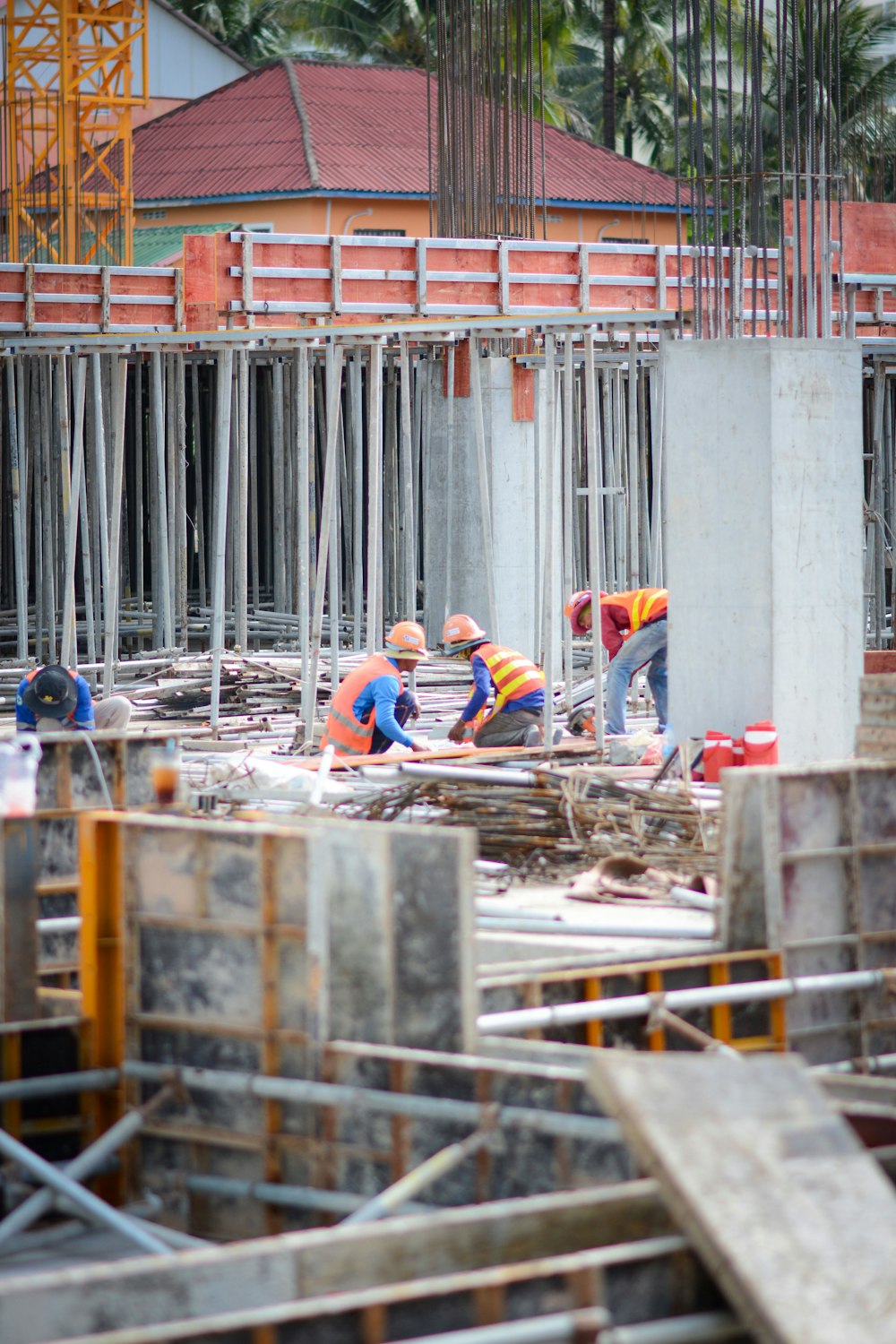 a group of construction workers working on a building