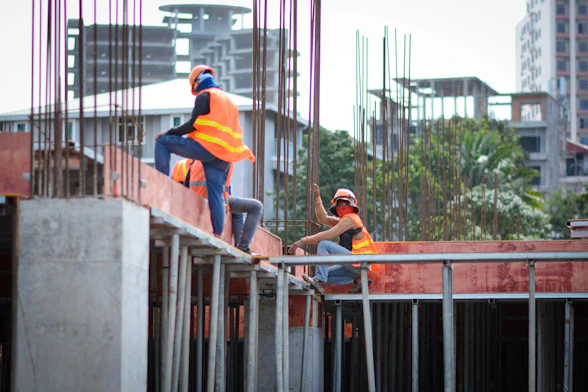 a few men working on a bridge