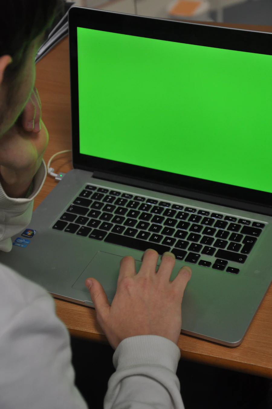 Person on a couch starting a video appointment on a tablet
