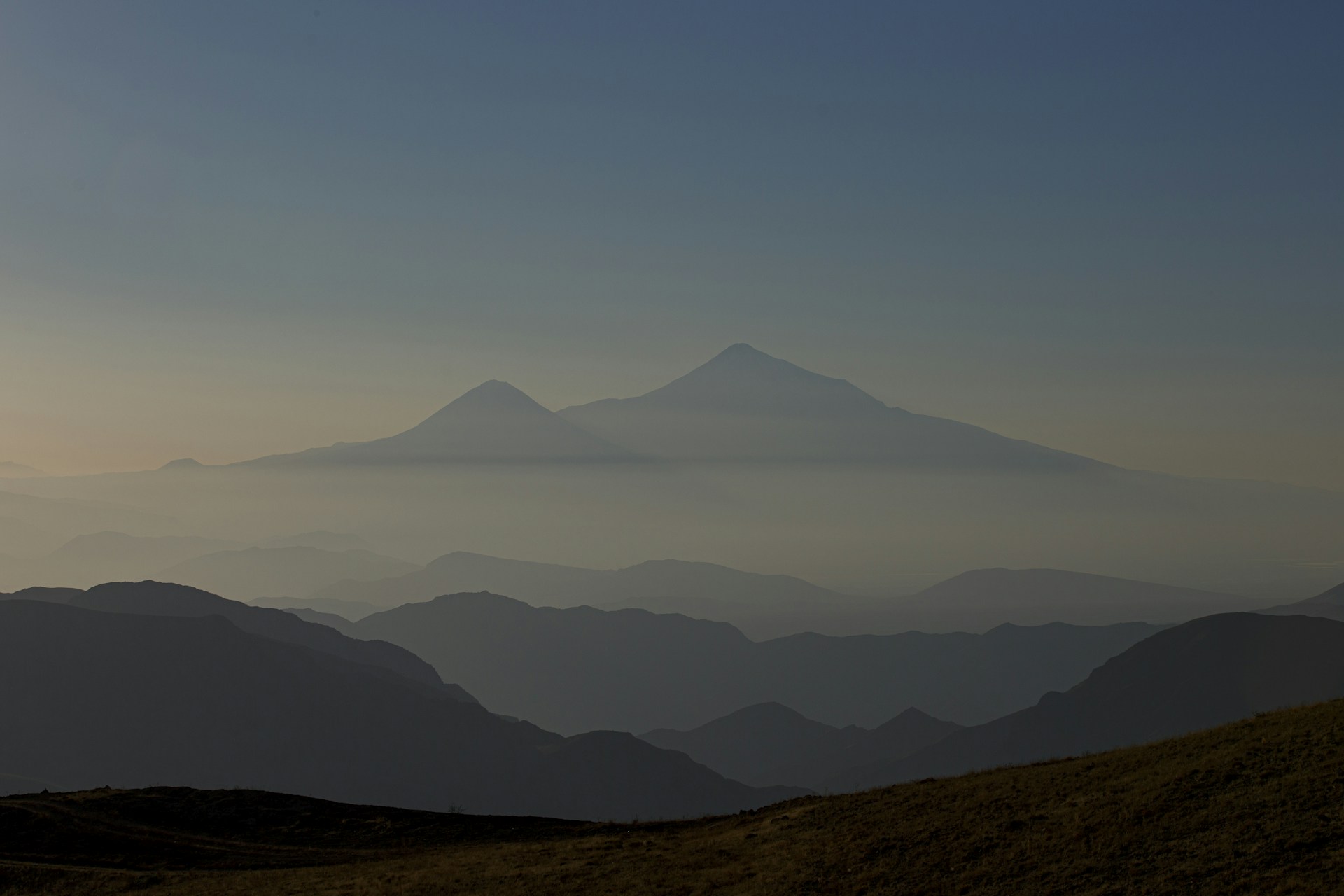 a mountain range with fog