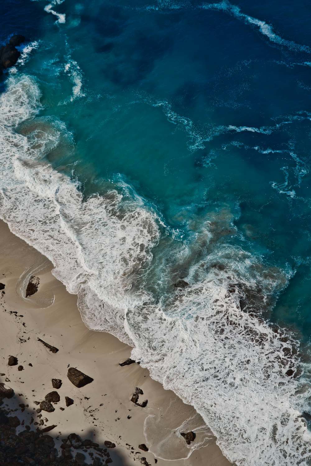 a beach with blue water