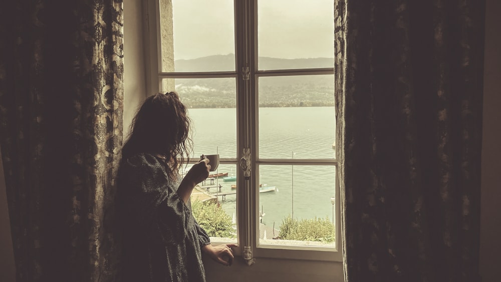 a person looking out a window