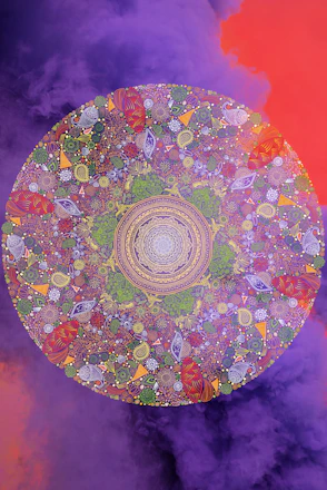 A vibrant mandala in jewel tones of red, orange, and violet with subtle geometric patterns.
