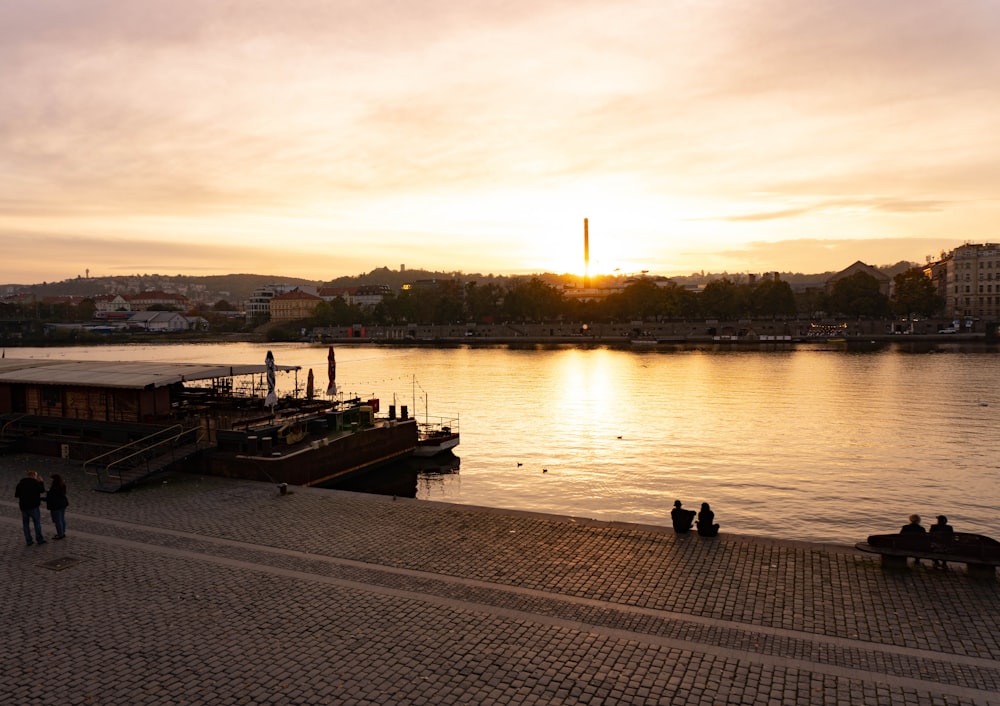 a body of water with a dock and buildings by it