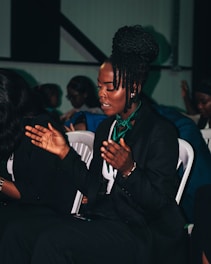 a person in a suit clapping