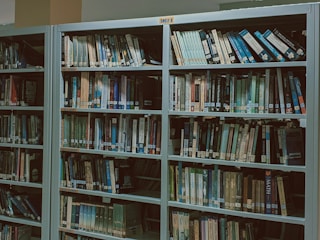 Volunteers setting up books and supplies in a community library.